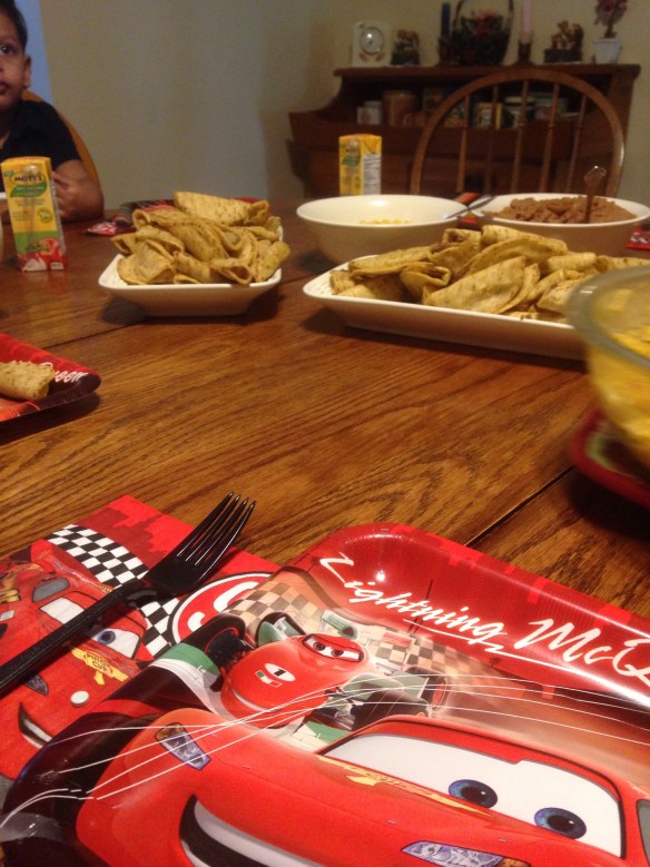 Toddler birthday dinner - mini tacos and juice boxes with car-themed plates!